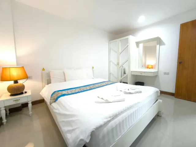 Bedroom with a double bed in the One Bedroom room at Baantip Suantong Resort — Gallery image 1
