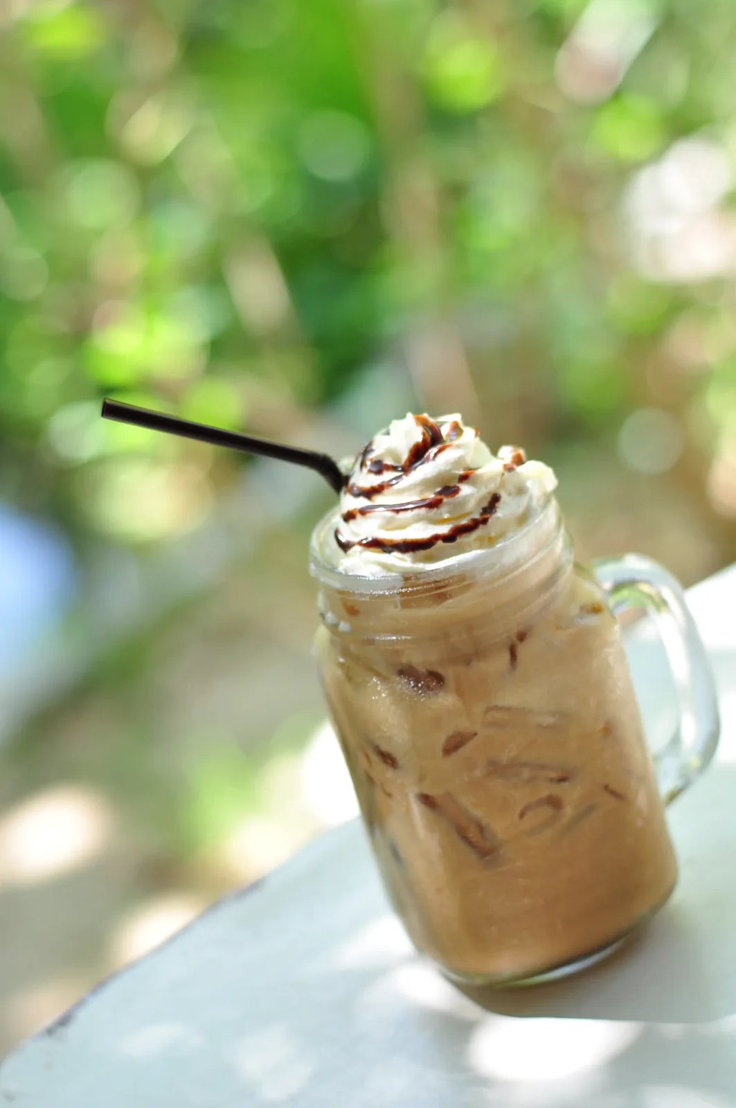 Iced coffee topped with cream