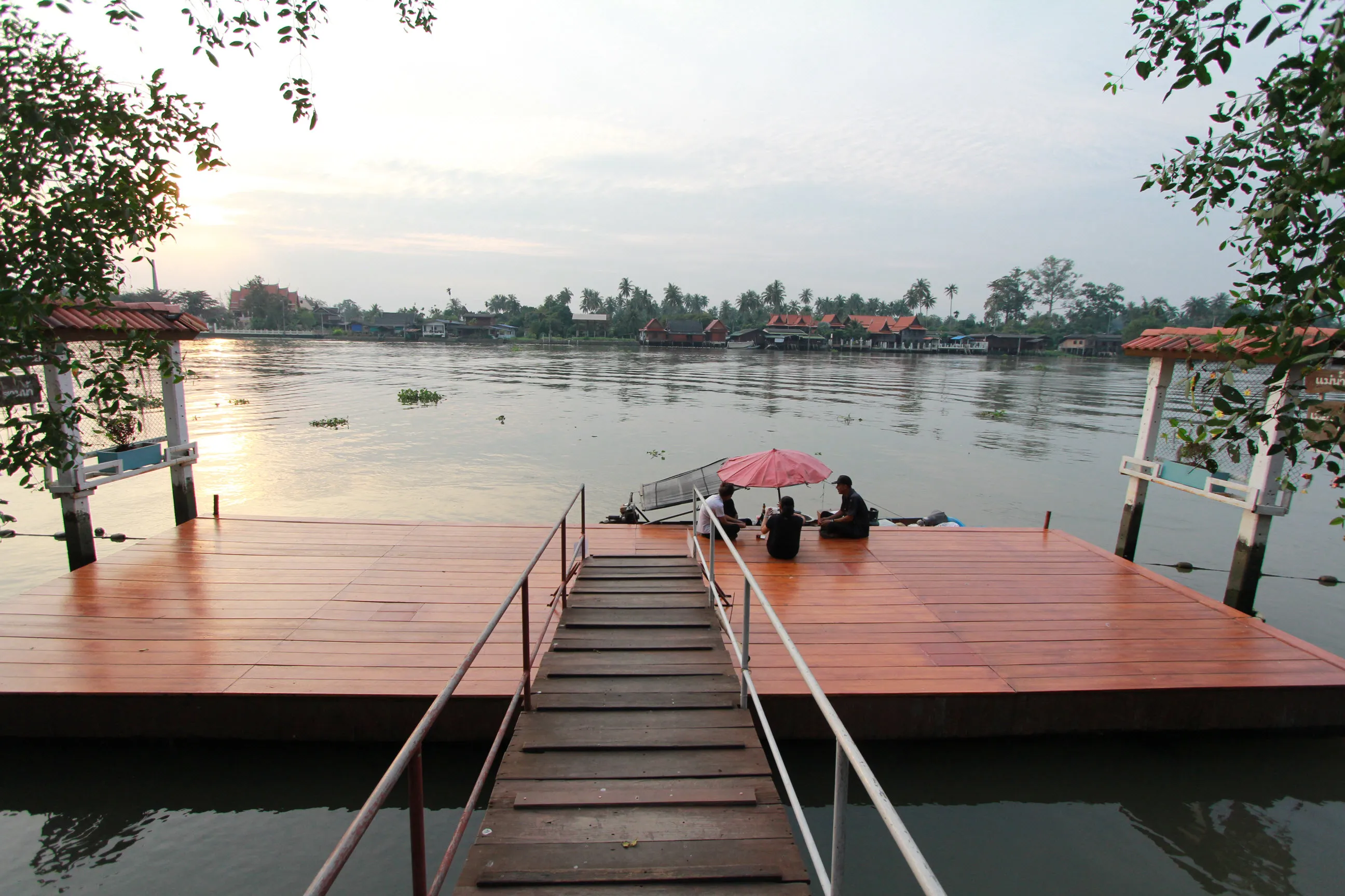 Baantip's wooden pier beside the river